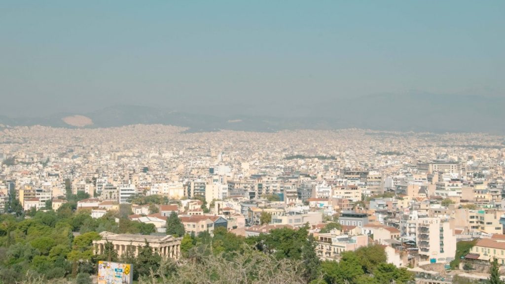 a view of a city from the top of a hill