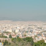 a view of a city from the top of a hill